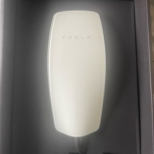 Tesla wall home charger.
